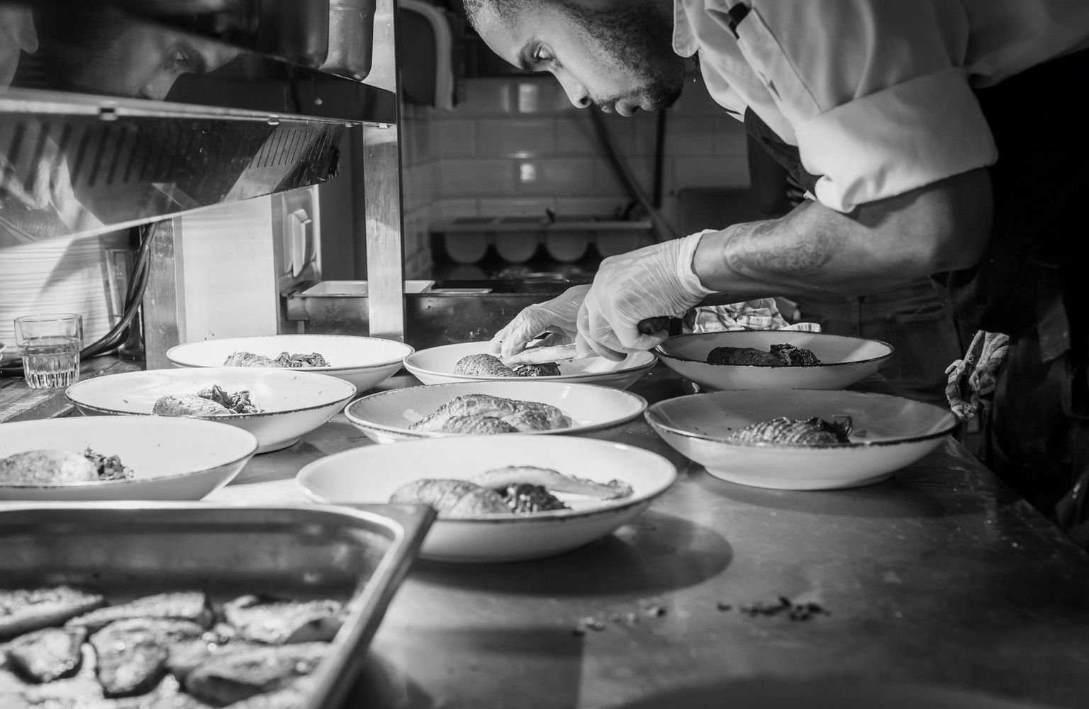 Skilled chef preparing well costed reciped